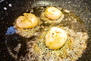 Image showing Fried scallops with butter and garlic sauce