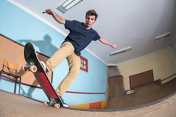 Image showing Skateboarder performing a blunt to fakie