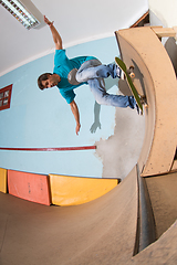 Image showing Skateboarder performing a backside turn