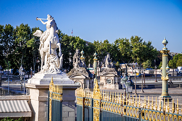 Image showing Marble statue and the Tuileries Garden entrance gate, Paris