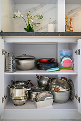 Image showing Closeup to modern kitchen cabinet content