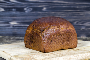 Image showing a whole loaf of black rye bread