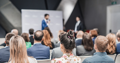 Image showing Pitch presentation and project discussion at business convention or team meeting. Audience at the conference hall. Business and entrepreneurship symposium.