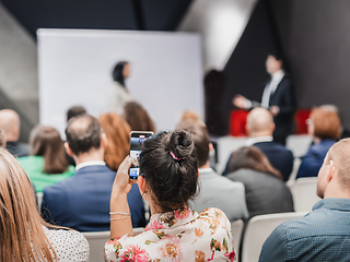 Image showing Pitch presentation and project discussion at business convention or team meeting. Audience at the conference hall. Business and entrepreneurship symposium.