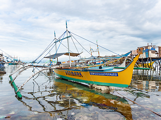 Image showing Filipino fishing boat in a sea of junk