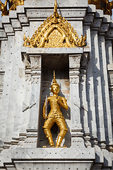 Image showing Gold guard on tower, Wat Phi, Thailand