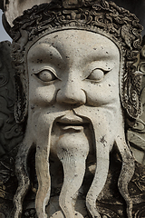 Image showing Wat Pho stone guardian face close up, Thailand