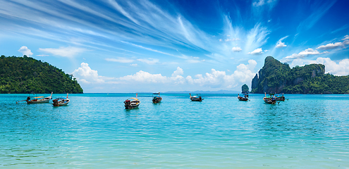 Image showing Long tail boat on beach on sunset