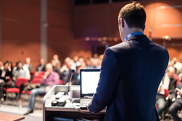 Image showing Public speaker giving talk at business event.