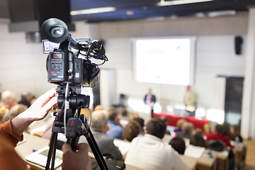 Image showing Television broadcasted press conference.