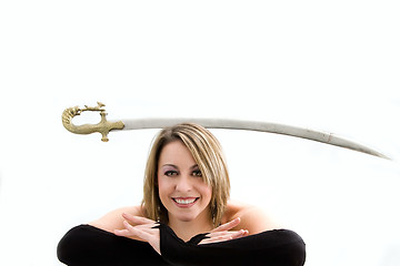 Image showing Blond balancing sword