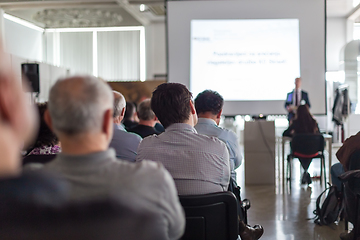 Image showing Business speaker giving a talk at business conference event.