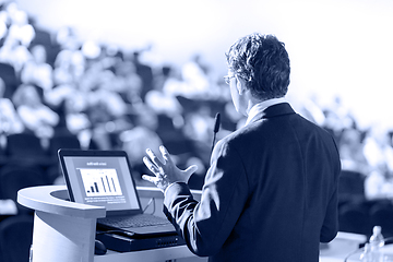 Image showing Speaker Giving Presentation at Business Conference at Lecture Hall.