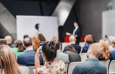 Image showing Pitch presentation and project discussion at business convention or team meeting. Audience at the conference hall. Business and entrepreneurship symposium.