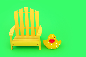 Image showing Crazy Surreal Composition with Yellow Chair and Spotted Duckling