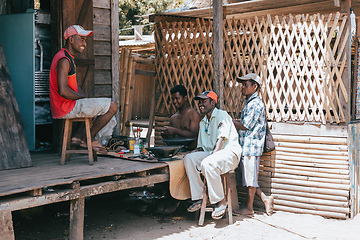 Image showing Malagasy men repairing speakers, Maroantsetra Madagascar