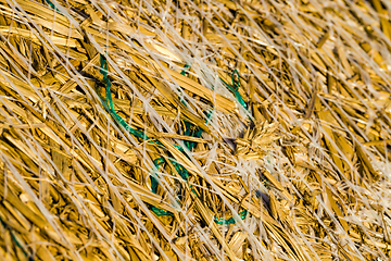 Image showing large cylindrical stacks of wheat straw