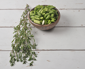 Image showing Beans and savory on wood