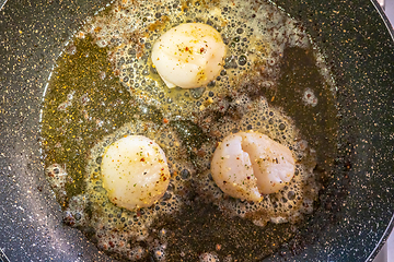 Image showing Fried scallops with butter and garlic sauce