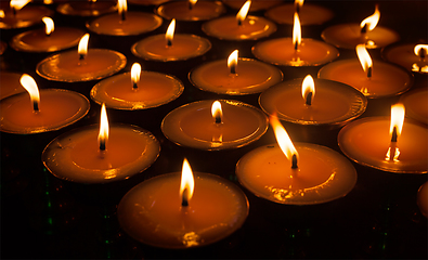 Image showing Burning candles in Tibetan Buddhist temple