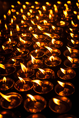 Image showing Burning candles in Tibetan Buddhist temple