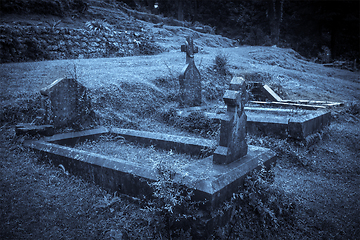 Image showing Spooky Halloween graveyard in fog