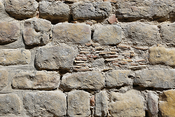 Image showing Very old vintage wall from large stones of various shapes and br