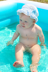 Image showing baby takes a bath in the swimming pool