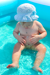 Image showing baby takes a bath in the swimming pool