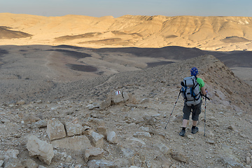 Image showing Hiking tourist in desert trek adventure