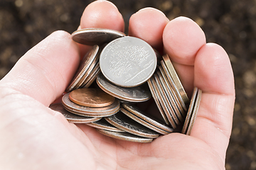 Image showing the hand of a man with coins