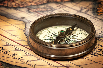 Image showing Old vintage compass on ancient map