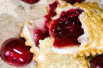 Image showing cherry jam in a crispy bun