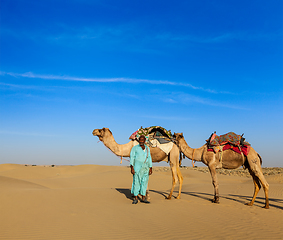 Image showing Cameleer (camel driver) camels in Rajasthan, India