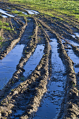 Image showing deep ruts on black soil
