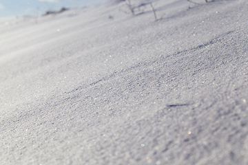 Image showing Snow drifts in winter - snow photographed in the winter season, which appeared after a snowfall. close-up,