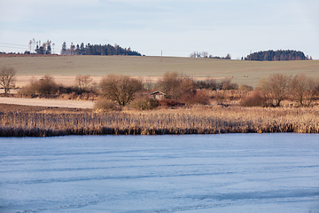 Image showing rural landscape with frozen small pond