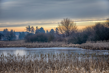 Image showing rural landscape with frozen small pond