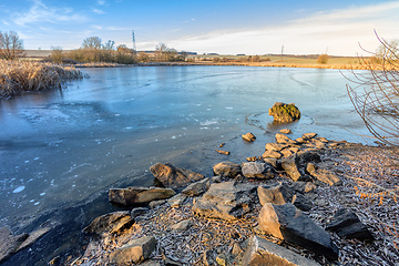 Image showing rural landscape with frozen small pond