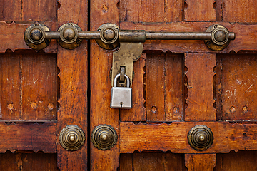 Image showing Latch with padlock on door