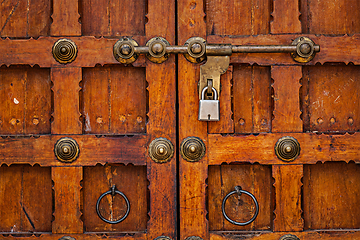 Image showing Latch with padlock on door