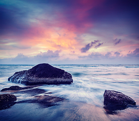 Image showing Waves and rocks on beach of sunset