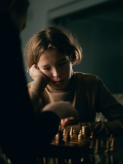 Image showing Teenager 12 years old plays chess