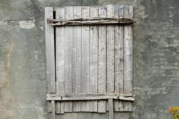 Image showing old window covered with gray wood