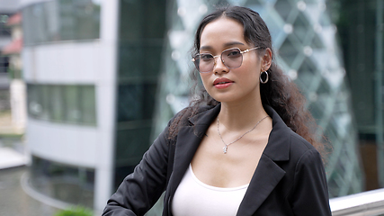 Image showing Portrait of asian businesswoman standing outside of office building