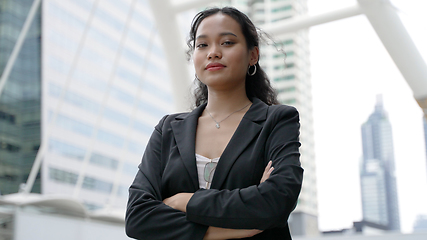 Image showing Asian Business woman with long hair dressed black jacket standing outdoor