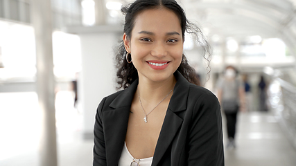 Image showing Portrait of asian businesswoman standing outside of office building