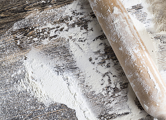 Image showing white wheat flour on a wooden table