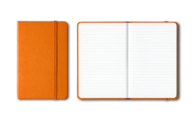 Image showing Orange closed and open lined notebooks isolated on white