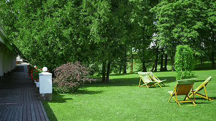 Image showing Rest chairs in the garden. Resort concept